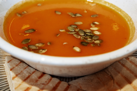 Pumpkin soup-puree with pumpkin seedsの写真素材