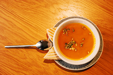 Pumpkin soup-puree with pumpkin seeds with pita bread from aboveの写真素材