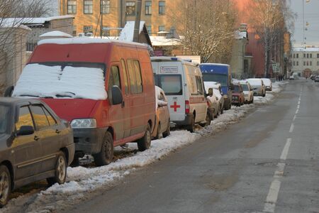 St.Petersburg Russia, 24 Feb 2016: Streets with cars covered with snow after hard snowfall parked in the lineのeditorial素材