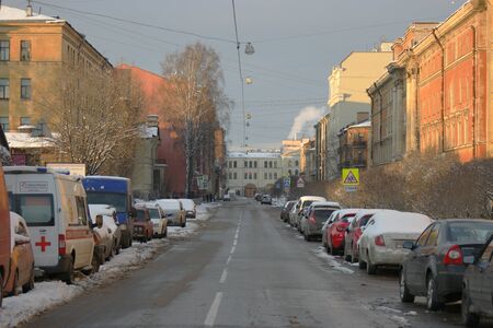 St.Petersburg Russia, 24 Feb 2016: Morning Streets with cars covered with snow after hard snowfall parked on both sides of streetのeditorial素材