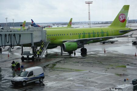 Moscow, Russia Feb. 26, 2016: S7 Siberian Airlines Airliner in Domodedovo Airport Loading. View from airport terminal. S7 is member of OneWorld Alliance.のeditorial素材
