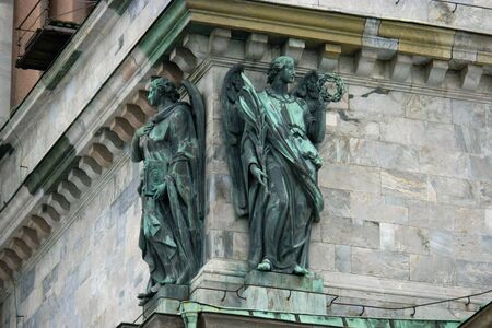 Saint Petersburg, Russia - Feb 26, 2016: Two angel figures of Saint Isaacs Cathedral in the winter. Facade Detail.のeditorial素材
