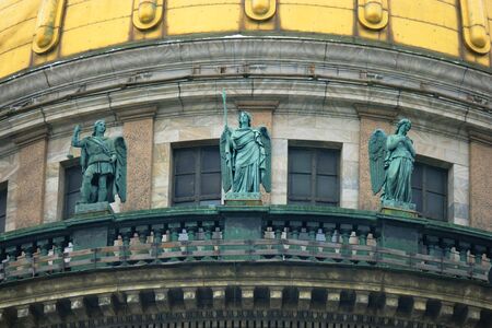 Saint Petersburg, Russia - Feb 26, 2016: Golden Dome with three angel figures of Saint Isaacs Cathedral. Ballustrade Detail.のeditorial素材