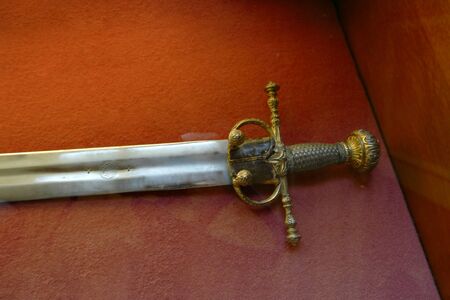 Saint Petersburg, Russia 26 Feb. 2016: Medieval Italian Sword In Hermitage Museum With Ornamental Guard Covered With Goldのeditorial素材