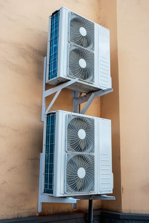 Diagonal view of Industrial cooling machine on the wall with copyspaceの写真素材