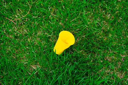 Earth issues. Plastic cup contaminate our common environmental spaceの写真素材