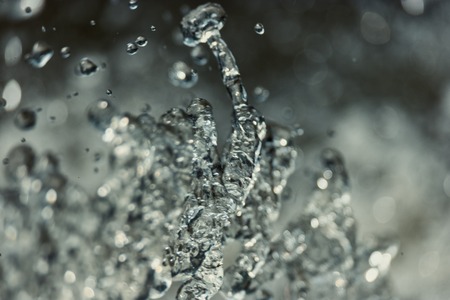 Water Splash On The Bluish Gray Background Frozen in An Air