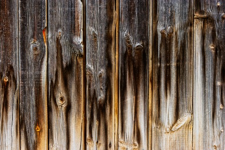 Worn aged plank fence background hanf dark half lightの写真素材