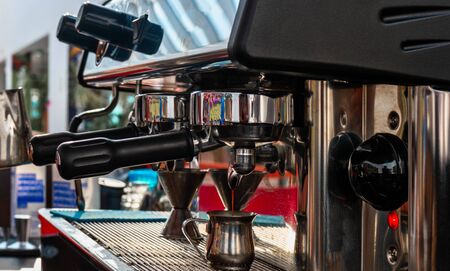 Coffee machine in coffee house producing espresso coffeeの写真素材
