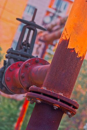 Natural gas pipeline with valve covered with rusty connectionの写真素材