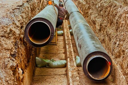 Utility infrastructure. Underground utility. Repair Work Of Heating Duct. Replacement Pipes Of The Heating Mainの写真素材