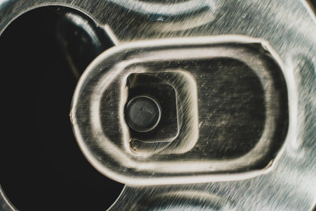 Aluminum Can Top Macro. Stay-on-tab opening mechanism On an aluminum beverage can. Beverage can pull...