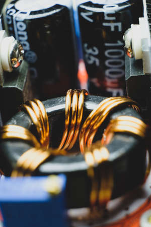 Induction coil copper wires and condencers of small electronic deviceの写真素材