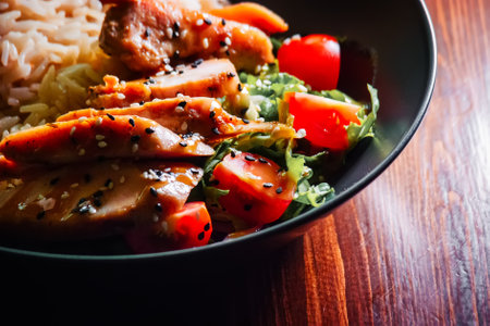 Curry food. Chapati chicken breast with rice and vegetables served in bowl on wooden table.の写真素材