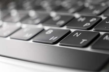 Computer keyboard shallow DOF. Backspace in main focus and keys with latin and Cyrillic symbols.の写真素材