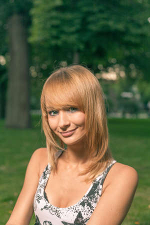 Young blond haired women smiling outdoorsの写真素材