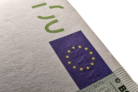 100 euro banknote with copyspace and EU marian starry flag , One hundred euro macro image. 100 number and copyspace.の写真素材