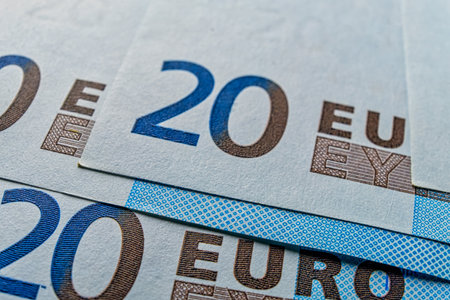 Pile of new 20 euros macro shot. Prices in EU going up and government have to print a plenty of new money provoking inflation.の写真素材