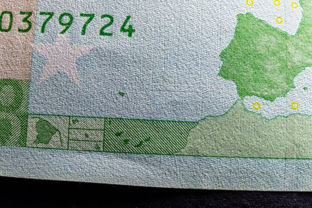 Fine microprint and serial number on hundred euro banknote protection against fraud macroの写真素材