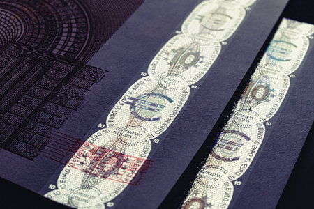 Foil Hologram tamper-proof currency seal authenticity watermark line of ten euro banknote macroの写真素材