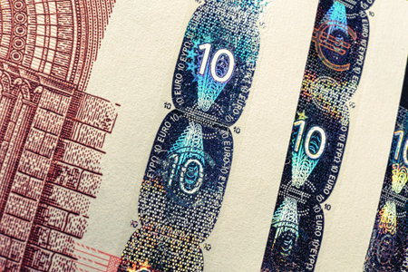 Hologram print on euro - Money euro currency seal, temper-proof counterfeits authenticity protection against forgery.の写真素材