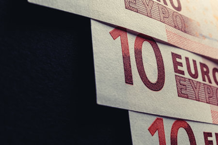 Set of 10 euros on a black background with copy space for the customer's name.の写真素材