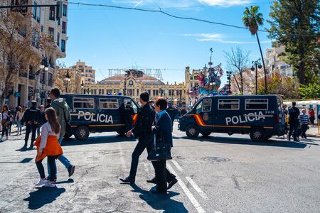Valencia, Spain; March 9 2019: Police street block during celebration of Fallas in Valencia. Traditional medieval festivity. Police protection.のeditorial素材