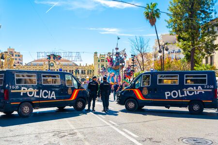 Valencia, Spain; March 9 2019: Police street block during celebration of Fallas in Valencia. Traditional medieval festivity. Police protection.のeditorial素材