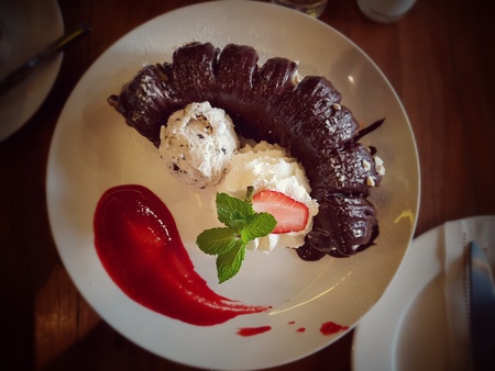 Banana crepe roll with chocolate sauce and ice cream