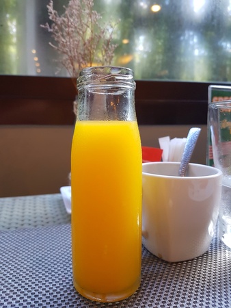 Orange juice on the table, it's make fresh.の写真素材