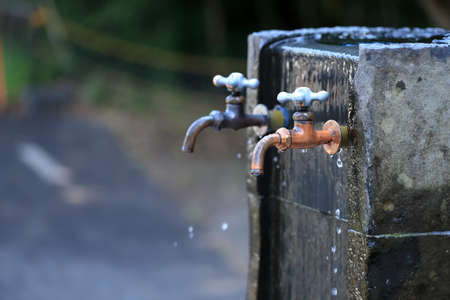 A faucet from which groundwater gushes out.の写真素材