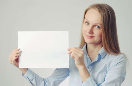 blonde girl with paper sheet. Poster or banner with copy-space concept