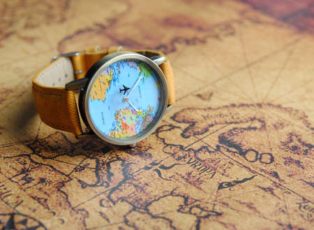 travel watch on vintage world mapの写真素材