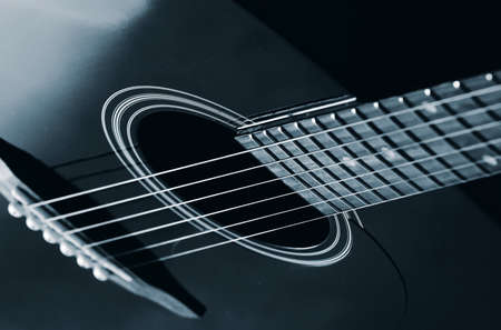 black acoustic guitar close up, studio lightの写真素材