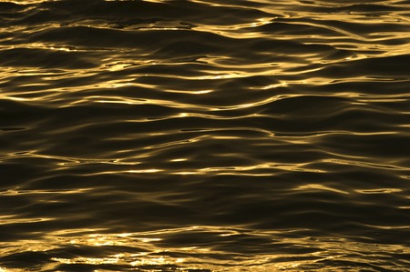 Ripples are beautiful golden surreal wave patterns on the water to form a mesmerizing nature...