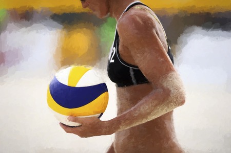 Volleyball player is a female athlete volley ball player getting ready to serve the ball.の写真素材