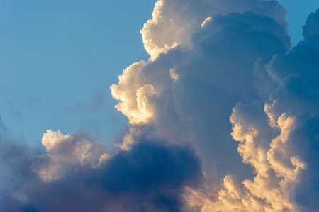 A Fluffy White Cloudscape of Cumulus Clouds and A Sky Blue Background