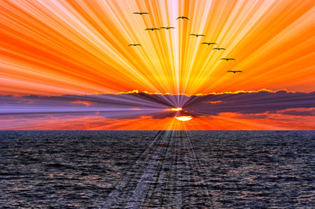 An Ocean Sunset With Sun Rays Emanating From Behind The Clouds Inspirationalの写真素材
