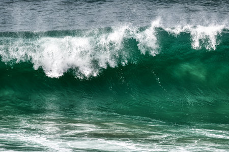 An Ocean Wave Is Breaking With White Spray At The Topの写真素材