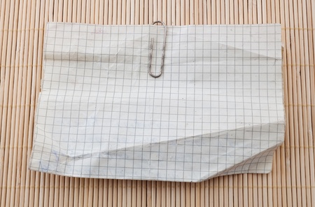 Old used paper on wooden background