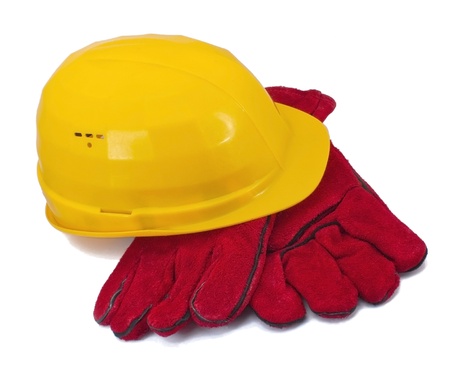 Yellow helmet and red gloves on white backgroundの写真素材