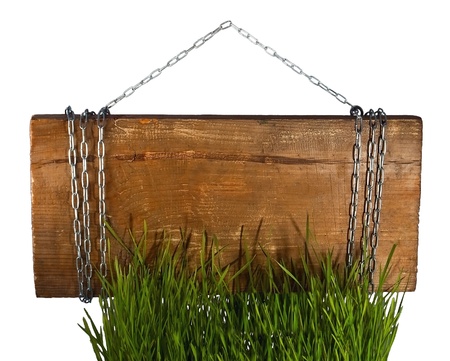 Signboard on metal chain with grassの写真素材