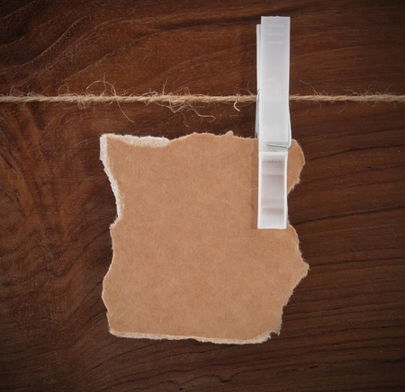 Card on the rope over wooden backgroundの写真素材