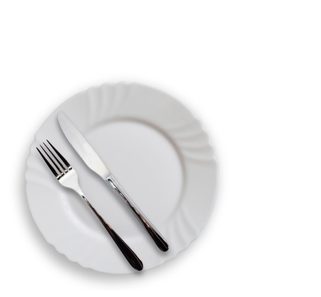 Plate with silverware on white backgroundの写真素材