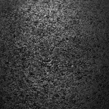 Asphalt road higlighted in night の写真素材