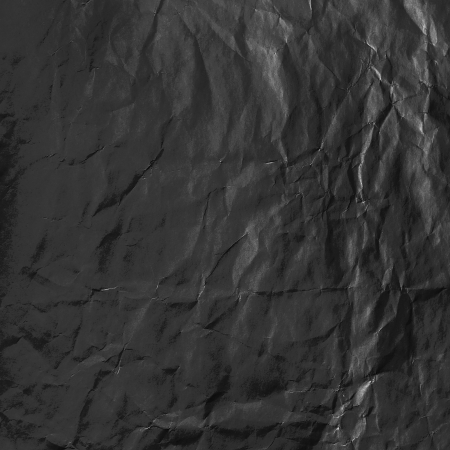 Wrinkled black blank paper surfaceの写真素材