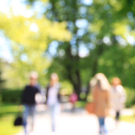 Abstract people in sunny spring parkの写真素材