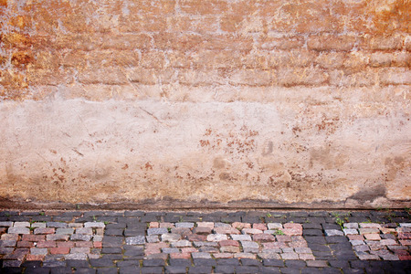 Urban street with red brick wall, side viewの写真素材