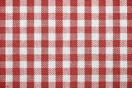 Empty table with red tablecloth