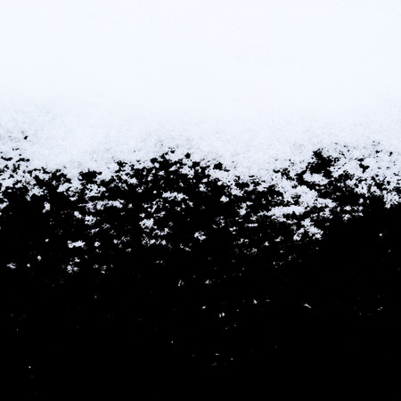 Snow crystals on black isolatedの写真素材